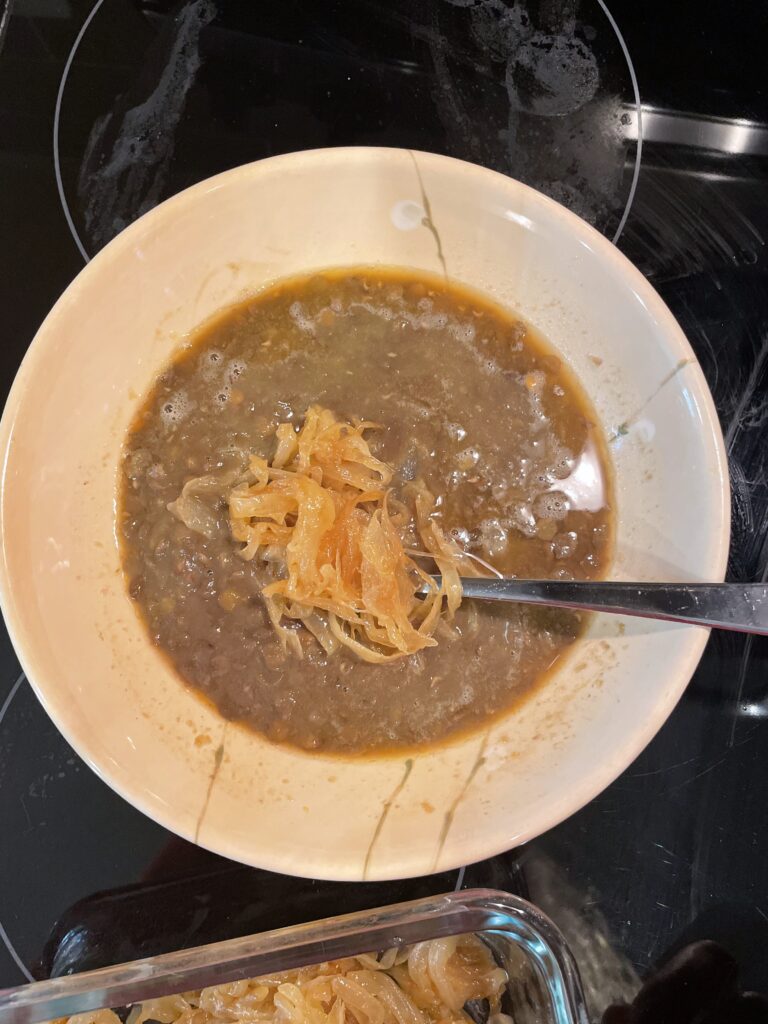 Green lentil soup with caramelized onions and turkey stock